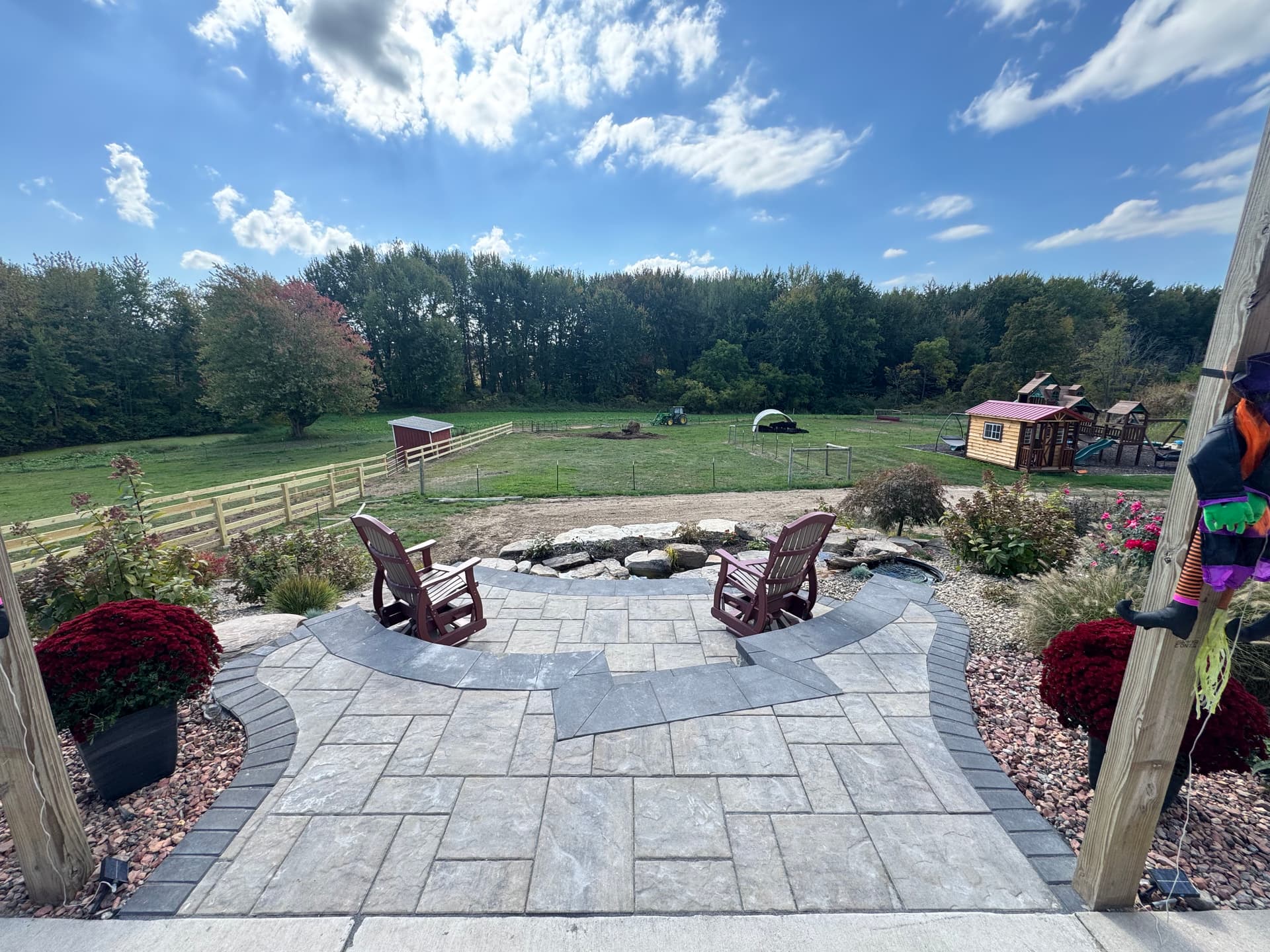 Hillside Turned Backyard Retreat With Koi Pond and Paver Patio